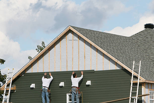 Professional Storm Damage Siding Repair technician working in Lakewood, IL